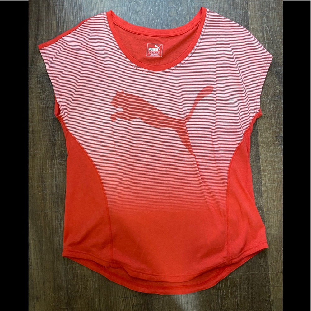 Puma coral colored top.